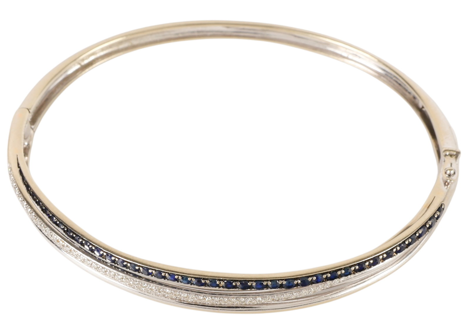 Effy 14k White Gold Diamond & Sapphire Bangle 11gr: Effy 14K white gold bangle bracelet set with sapphires and diamonds in a crisscross design. The diamonds total approximately 1/3 carat, and the sapphires total just over 1 carat. Designed to fit wrist