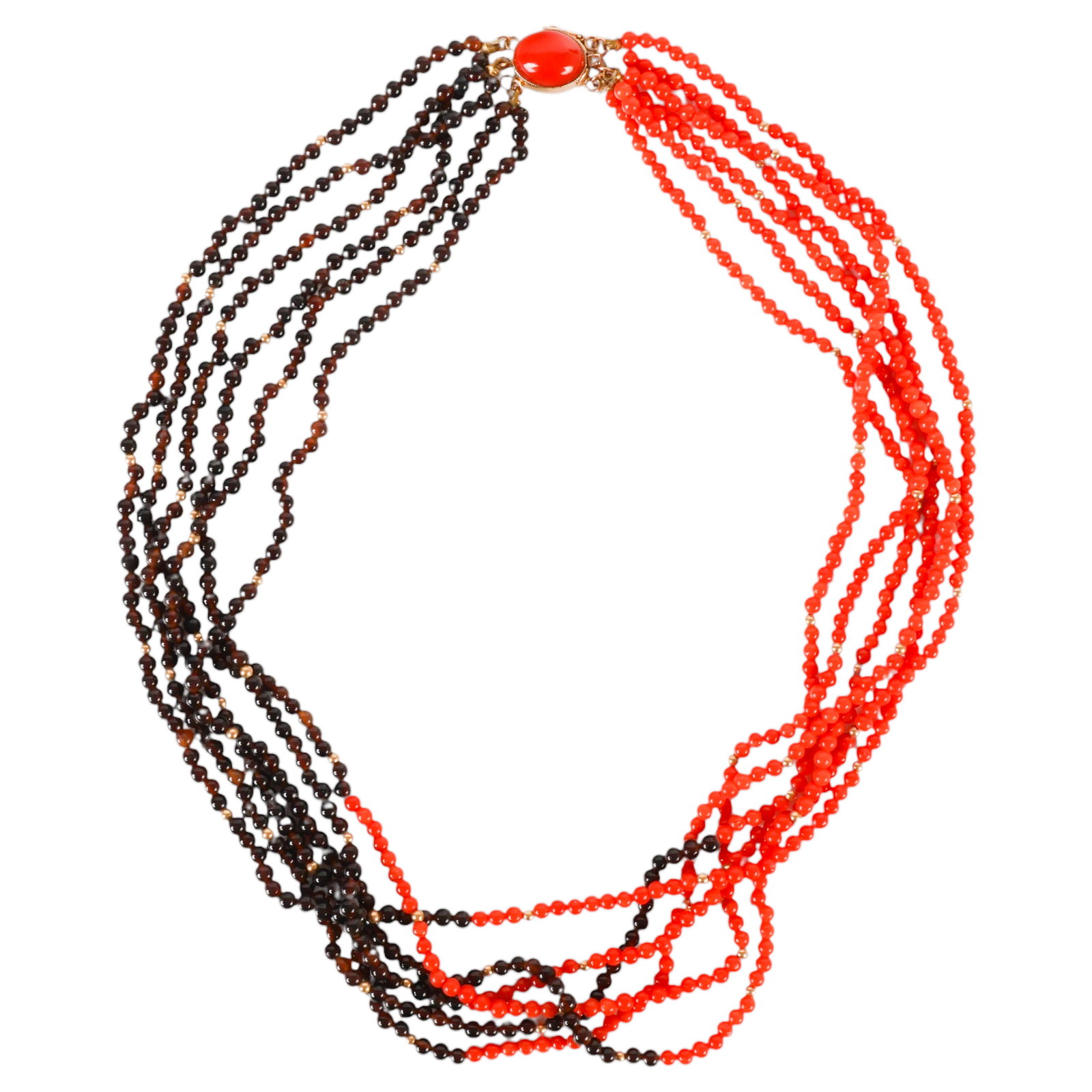 14K Gold Coral Garnet Six Strand Torsade Necklace: 14K yellow gold six strand torsade necklace composed of polished round coral and garnet beads arranged in alternating sections with polished gold spacer beads. The necklace terminates with an oval 14K