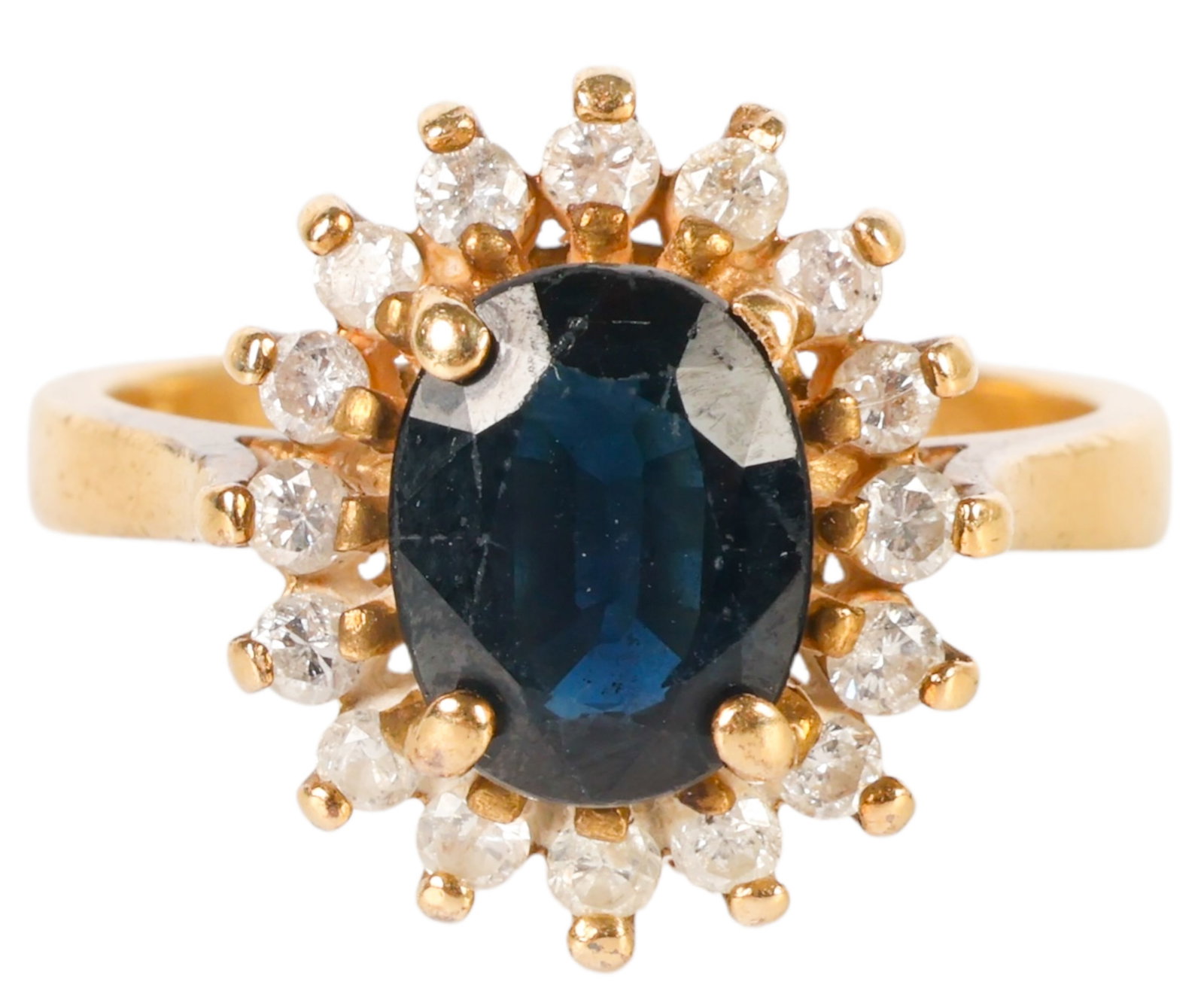 14K Gold Sapphire & Diamond Halo Cocktail Ring 4g.: Ladies' designer-style cocktail ring crafted in 14K gold, centering an oval sapphire surrounded by 17 round diamonds. The ring has an approximate combined gemstone weight of 2.5 carats and an