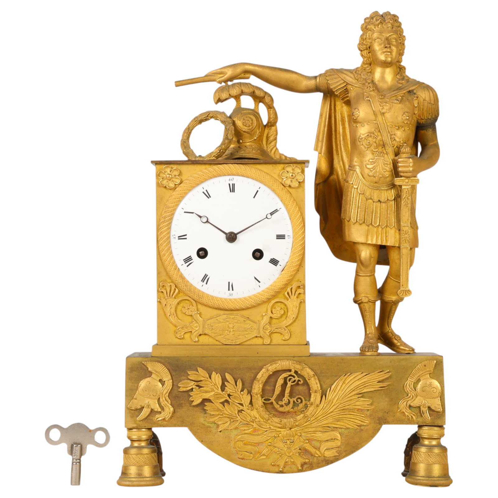 Antique French Empire Bronze Figural Mantel Clock: 19th century French Empire gilt bronze shelf clock depicting Louis XIV as a Roman emperor, wearing a breastplate and holding a command baton and sword. The rectangular case features an enameled Roman 