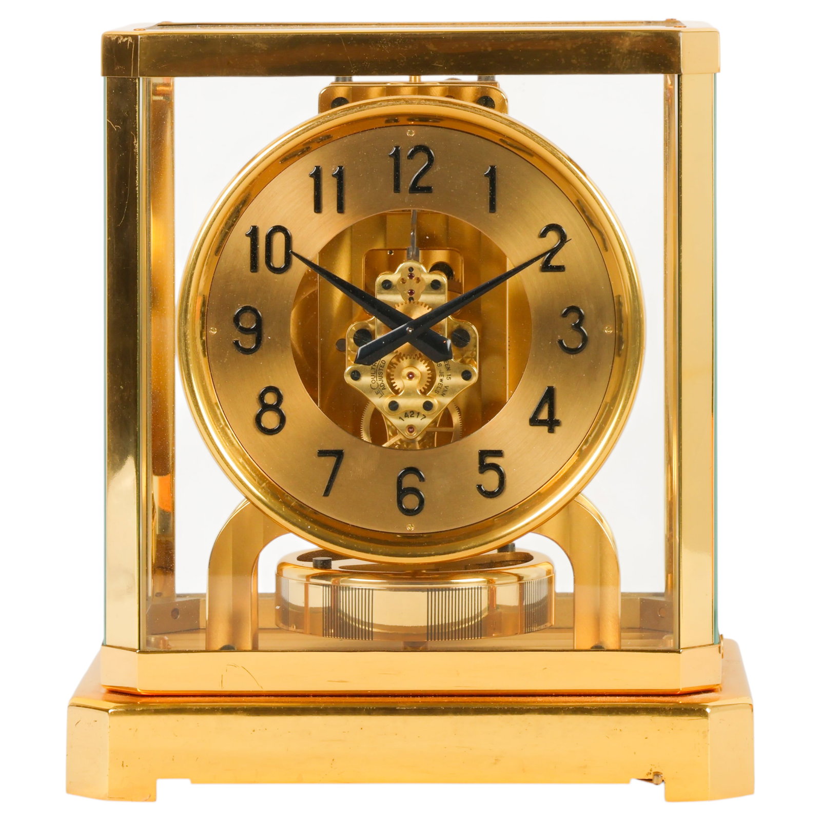 Jaeger-LeCoultre Atmos Vintage Brass Mantel Clock: Jaeger-LeCoultre Atmos mantel clock featuring a gilt brass and beveled glass case enclosing a champagne-tone Arabic numeral dial with visible movement. The movement is signed LeCoultre Switzerland