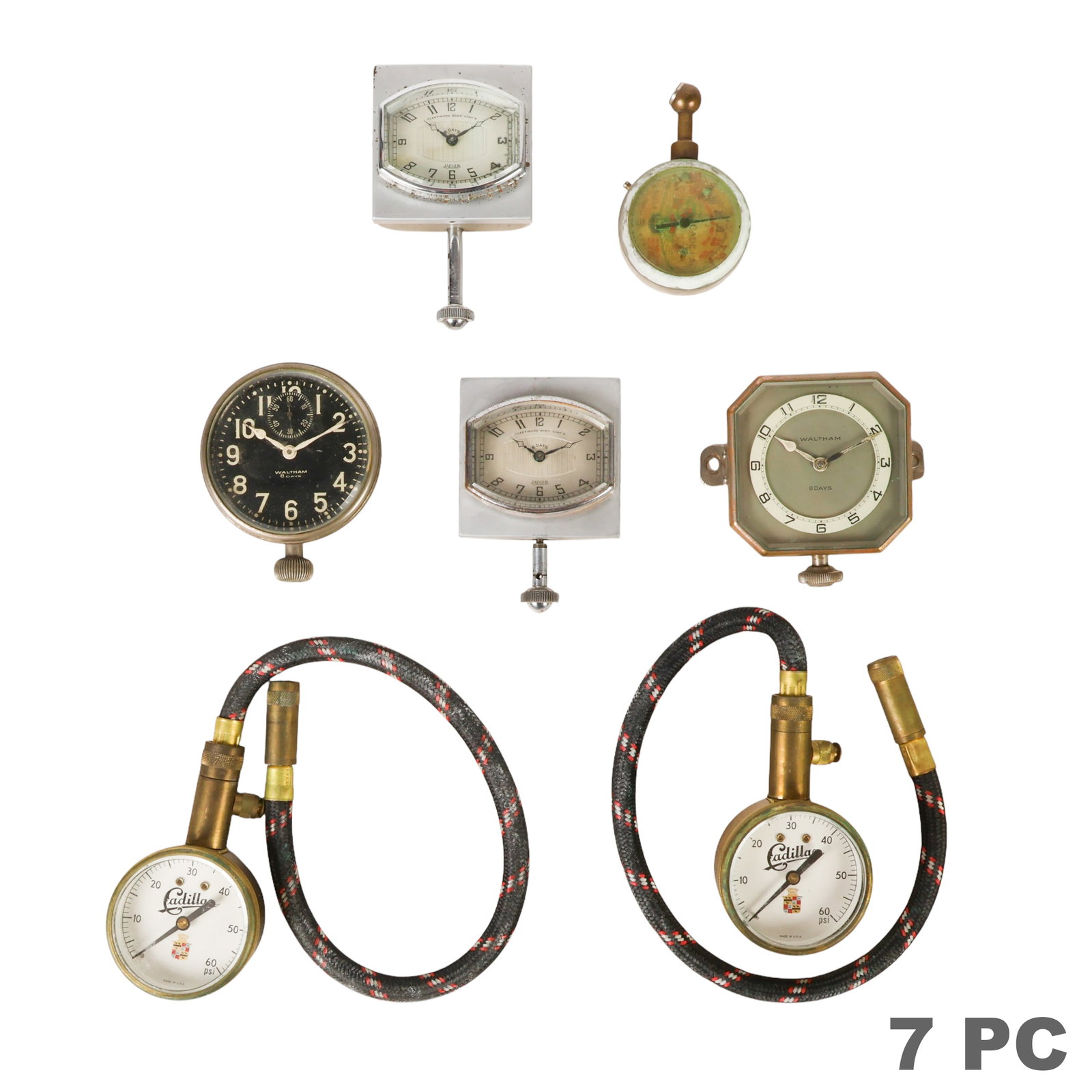 Cadillac Gauges Jaeger and Waltham Auto Clocks LOT: Lot of seven vintage automotive accessories comprising two Jaeger 8-day automobile dashboard clocks, each designed for Fleetwood Body Corp. automobiles with Art Deco-style cases, chrome bezels, and