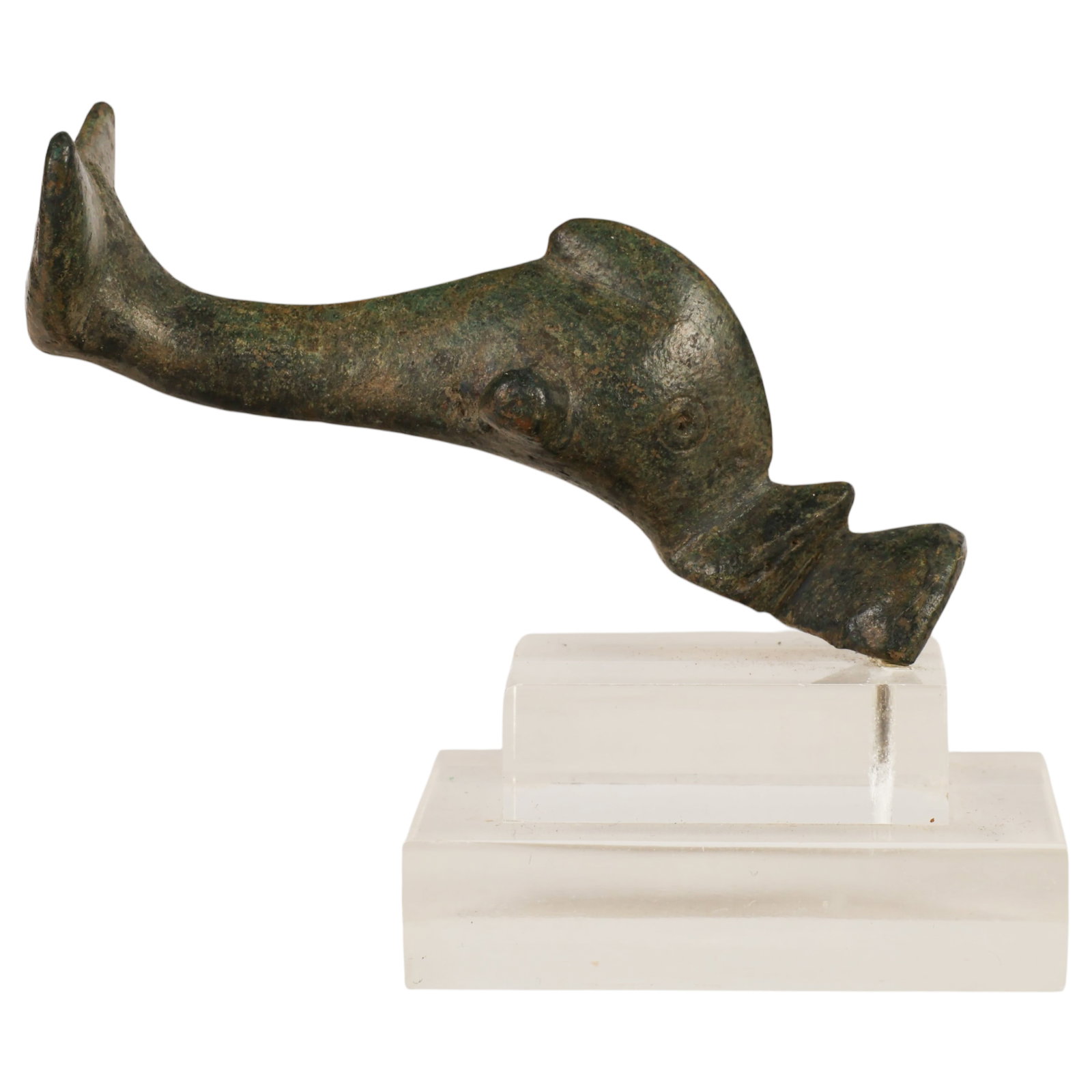 Ancient Roman Bronze Stylized Dolphin Sculpture: Roman style bronze figurine depicting a dolphin with an arched body, rounded head, dorsal fin, pectoral fins, and bifurcated tail. The figure is mounted on a modern clear acrylic display stand and ret