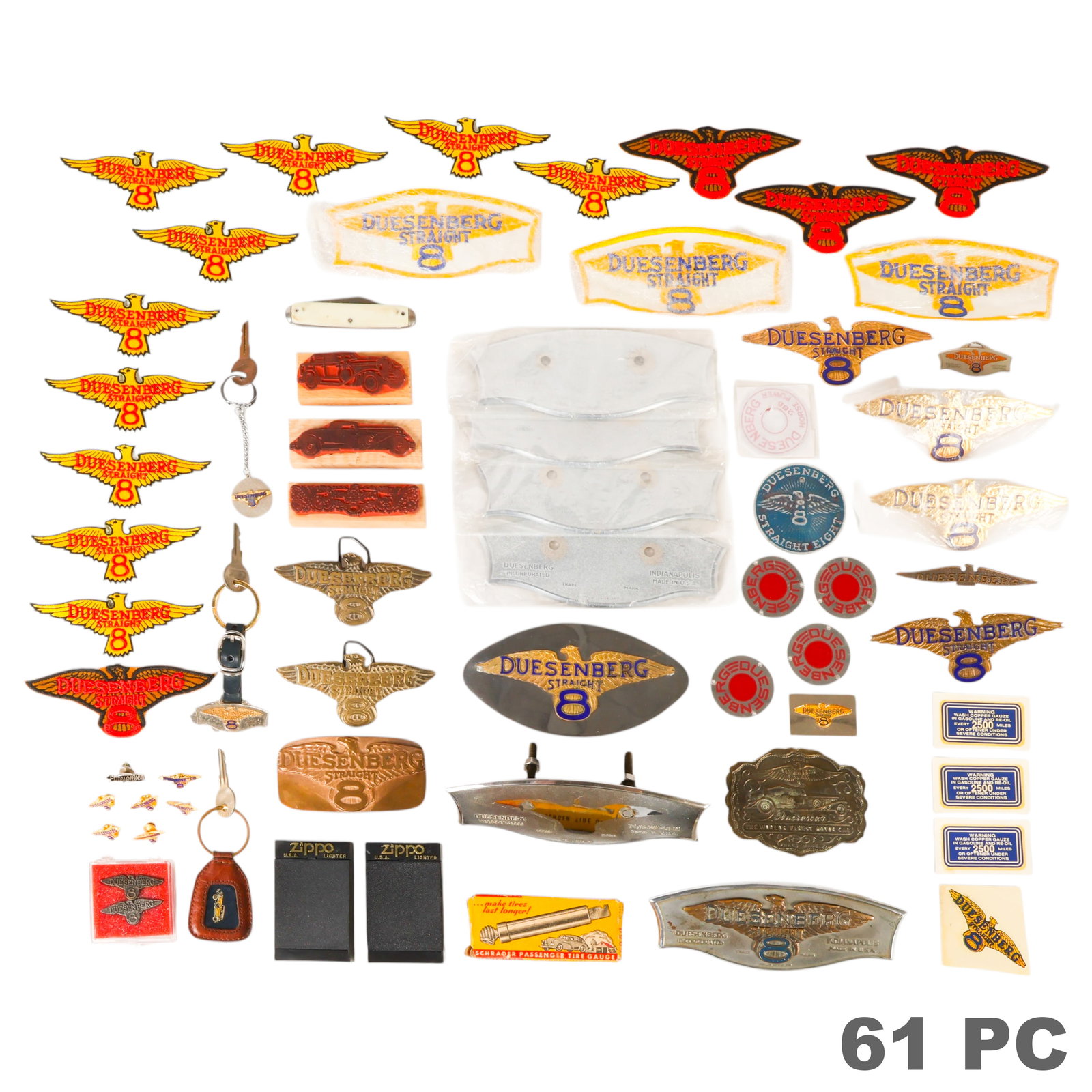 Duesenberg Straight Eight Collectibles ESTATE LOT: Lot of approximately 60 vintage Duesenberg Straight Eight automobilia and advertising collectibles. The group includes six metal firewall plaques or emblems, two Zippo lighters with Duesenberg
