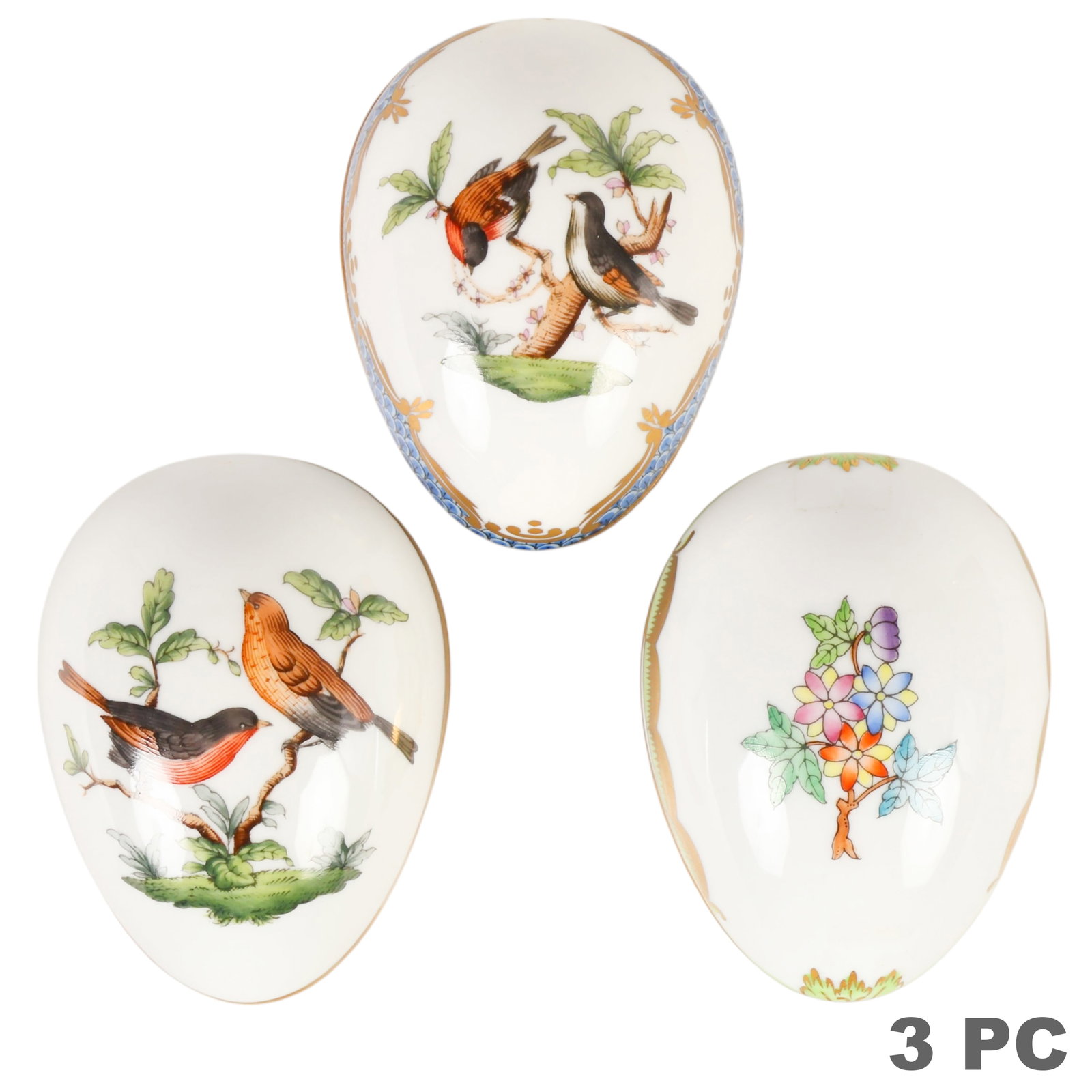 Herend Rothschild Bird Queen Victoria Egg Box 3pc: Herend lot of three hand-painted porcelain egg-form bonbon or trinket boxes comprising two Rothschild Bird pattern examples featuring birds perched on flowering branches, including one with a blue sca