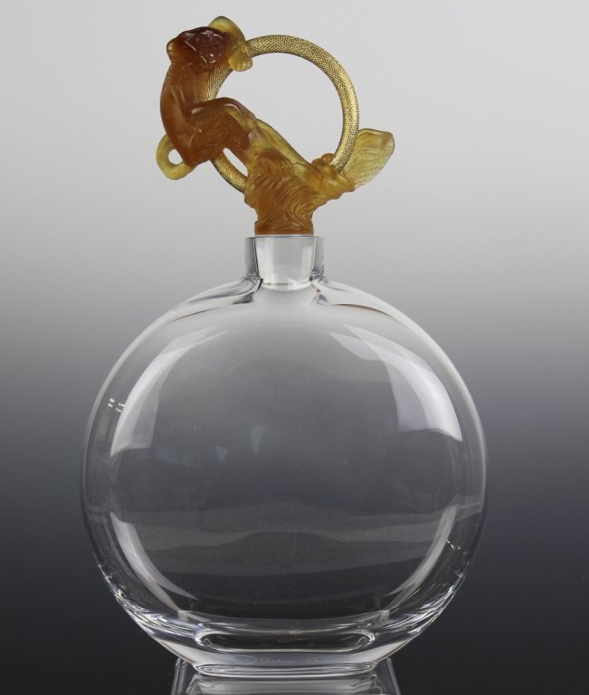 Signed Daum Crystal Pate De Verre Monkey 12" Decanter: Daum Pate De Verre Decanter. Crafted Of Fine Quality French Art Glass. Features A Orange Monkey Stopper. Signed Daum France. Measures Approximately 12" Height 7" Length 2 1/4" Wide. In House US Shippi