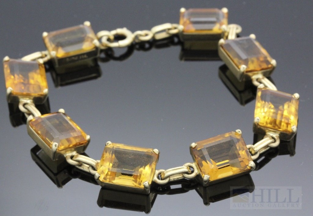 Tiffany & Co 14k Gold 45 CT TW Golden Citrine Bracelet: Fabulous signed Tiffany & Co art deco bracelet. Crafted out of 14k gold. Features large emerald cut Golden Citrine gemstones. Approximately 45 carats total gemstone weight. Secure spring ring clasp. S