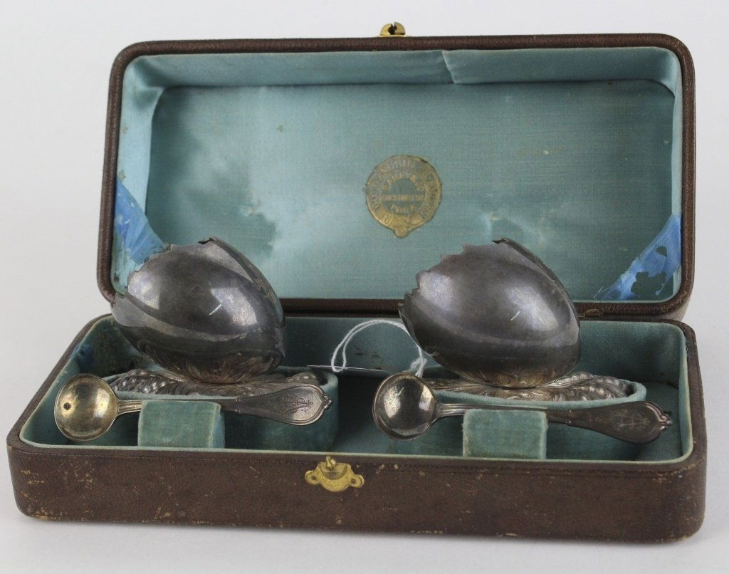 Pair of GORHAM Sterling Silver Figural Egg Salt Dips: Rare pair of signed Gorham figural master salt cellar dips. Crafted out of Sterling Silver. Features a broken egg design with gilt interior atop a cast wheat straw motif base. Fancy engraved SA Monogr