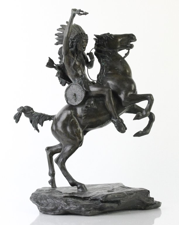 After: Carl Kauba Indian Warrior on Horse 16" Bronze: Vintage cast bronze sculpture of a Native American Warrior on horseback after the original by Carl Kauba. Features a fierce arrow toting man on rearing horse. Signed on Base. Measures 16 3/4" x 13" . 