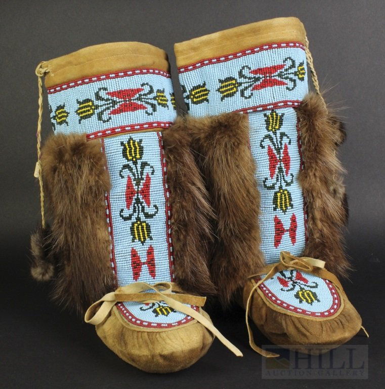 Pair Native American Beaded Fur Moccasins Mukluks Boots: Pair of Native American Mukluks or Moccasins. Crafted out of leather with Beaver fur trim. Features a well crafted beaded decorated design. Comes with a note attributing them to the Dene Tribe. Measur