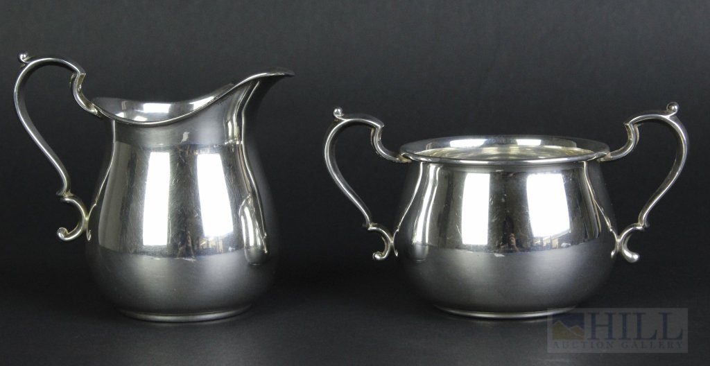 Pair of FISHER Sterling Silver 925 Sugar Bowl & Creamer: Vintage mid century signed FISHER creamer and sugar set. Crafted out of solid sterling silver. Chippendale style handles with smooth line design. Measures 3 1/4" x 3 7/8" and 2 7/8" x 5" Total weight 
