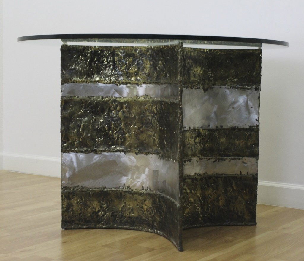 Silas Seandel Brutalist Mixed Metal Modern Dining Table: SIGNED Silas Seandel dining table. Crafted of mixed metals in a mid century modern brutalist design. Thick Glass Top. Base measures 29" x 22" Glass 42" Across. Contemporary of Paul Evens. Local Pick U