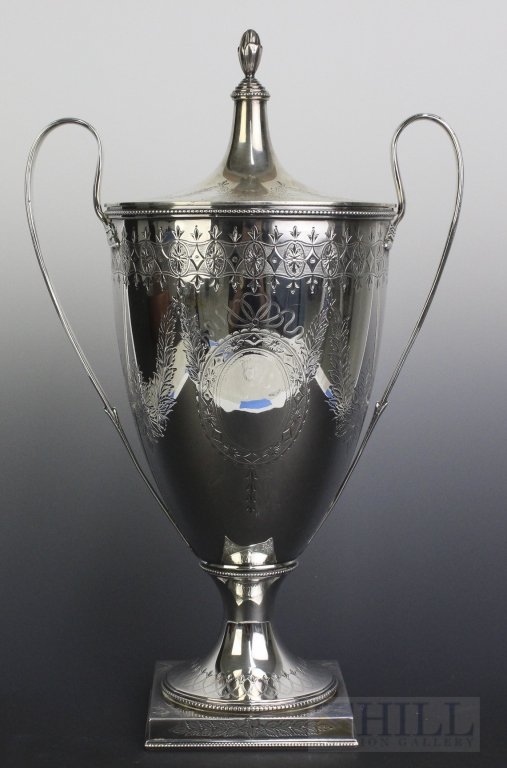 Howard Co Sterling Silver Double Handled Urn Loving Cup: Howard & Co. New York 1910 Sterling Silver Urn/Cup. Beautifully Etched Design Throughout With Double Handle And Covered Lid. No Monogram. Measures Approximately 13.5" x 8'. Weighs 1318 Grams. In House