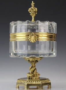 Signed MARTIN BENITO Crystal & Bronze Footed Box: Gorgeous centerpiece lidded box by Martin Benito. Crafted of fine quality French cut crystal. Bronze mounts with gold gilt finish. Octagonal base with three entwined dolphins as the stem and a