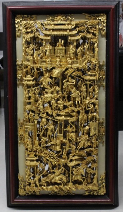 LARGE 58" Chinese Hand Carved Gold Gilt Wood Panel: LARGE Chinese Gilt Carved Wood Panel. Depicting A Very Ornate Monumental Narrative Scene Of Figures engaged in Battle. Measures Approximately 58" x 31" x 4 1/2" Depth. Good Condition. Will Not Ship Du