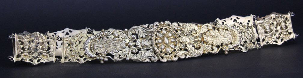 Antique English Gilt Sterling Silver Ornate Belt: Fabulous Antique Victorian Renaissance Revival style ladies belt. Crafted of solid sterling silver with a gold wash. Features ornate pierced panels with cherub heads and grapes. Large buckle with