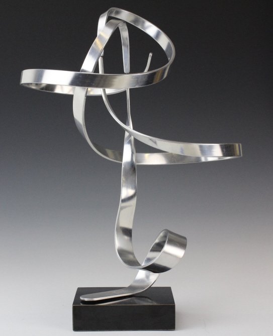 Charles Taylor Signed Modernist 14.5" Kinetic Sculpture: Signed Charles Taylor (American 20th Century) Kinetic Sculpture. Modernist Design in silver finished aluminum. Mounted to a black formica base. Signed and numbered 163. Measures approximately 14 1/2"