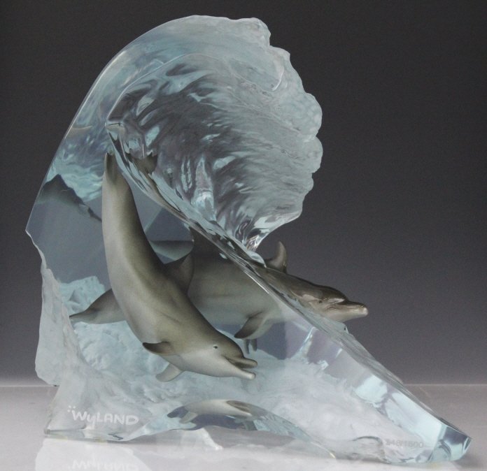 Signed ROBERT WYLAND Dolphin Wave Riders Sculpture: Signed Robert Wyland (1956 California / Florida) acrylic and bronze sculpture. Dolphin Wave Riders captures the joy of wild dolphins frolicking in the waves. Limited edition number lower right, Wyland