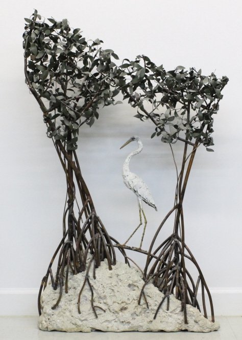 Jim Lewk Copper Stone Mangrove Heron 46" Sculpture: Jim Lewk Sculpture. Crafted of fine quality painted copper with limestone coral base. Depicts a heron bird walking through a Florida mangrove habitat. Signed "J Lewk 1992." Measures Approximately 46"
