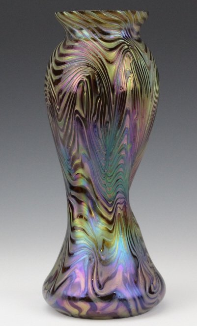 Rindskopf Phänomen Type Art Nouveau Glass 10" Vase: Antique Rindskopf Loetz Type Vase. Crafted of Fine Quality art glass. Strong surface with deep etched Phänomen design. Iridescent surface over an amber body. Dynamic pinched and twisted waist with bu
