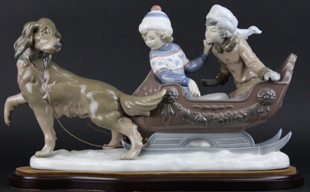 Retired LLADRO Dog Sled Sleigh Porcelain Figurine: Retired large Lladro "Sleigh" figural grouping statue. Crafted of fine quality Spanish porcelain. Features a dog pulling a sled with two children inside. Number 5037 first issued in 1980 and retired i