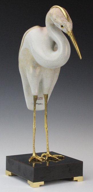 Oggetti Mangani Porcelain Crane 14" Bird Sculpture: Vintage Hollywood Regency style Heron or Crane sculpture by Oggetti Mangani. Crafted of fine quality Italian porcelain. Features a wonderful hand painted gold finish. Gold gilt metal legs mounted to a
