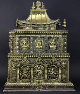 19th Century Nepalese Jeweled Gilt Bronze 34.5" Shrine: Stunning antique 18th to 19th century Nepalese shrine. Crafted of repousse bronze with gilt finish. Features a three story structure with well detailed deities and seated Buddha figures with jewel enc