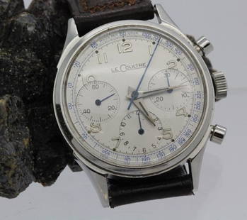 1940's Mens LeCoultre Stainless Steel Chrongraph Watch: Triple Signed Mens vintage LeCoultre chronograph wrist watch. Stainless steel case with white face. 72 Valjoux movement. Leather band. Case measures 42.5mm x 35mm. Good working condition with light