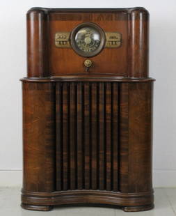 '37 Zenith Long Distance Console Radio from BASS MUSEUM: Vintage 1937 Zenith long distance black dial console radio. Model number 5808 automatic & tube receiver. Features classic mahogany and rosewood case. Comes with original instruction booklet and extra