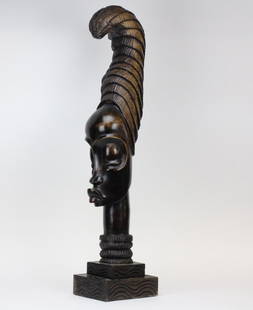 35" Wood Haitian Female Sculpture Morris Lapidus Estate: Vintage hand carved solid wood Haitian sculpture. Carved with the likeness of a strong featured woman in an exaggerated head dress. From Morris Lapidus' personal Miami residence. Previously installed