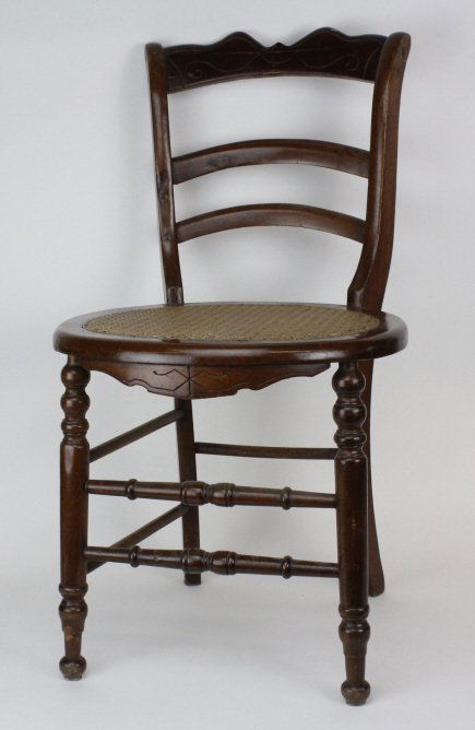 19th C. Haitian Colonial Carved Wood Cane Seat Chair: Antique 19th century Haitian colonial era chair. Crafted of carved hardwood with a caned seat. From the Bass Museum of Art collection. Measures 34" tall. Good condition with old repairs and loose glue