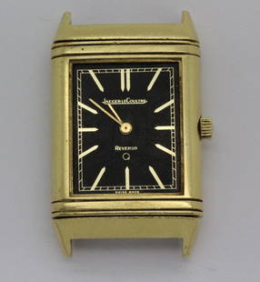 Vintage 18k Gold LeCoultre Reverso Wrist Watch: Mens vintage LeCoultre Reverso wrist watch. Housed in a solid 18k yellow gold case with black face. Quartz movement. Face signed LeCoultre. Case signed with Swiss 18k hallmarks. Case measures 38mm x