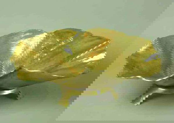 OAKAR J.W. HANSEN BRASS LOTUS LEAF SCULPTURE: Norway/Virginia 1892-1971, Stamped Verso "Lotus Leaf Copyright 1948 Osker J.W. Hansen/Harvin Co. No. 3514 Polished Brass, 5 1/2"H. 15"W. Complete With Circular Stand, Provenance: Privatre Collection.