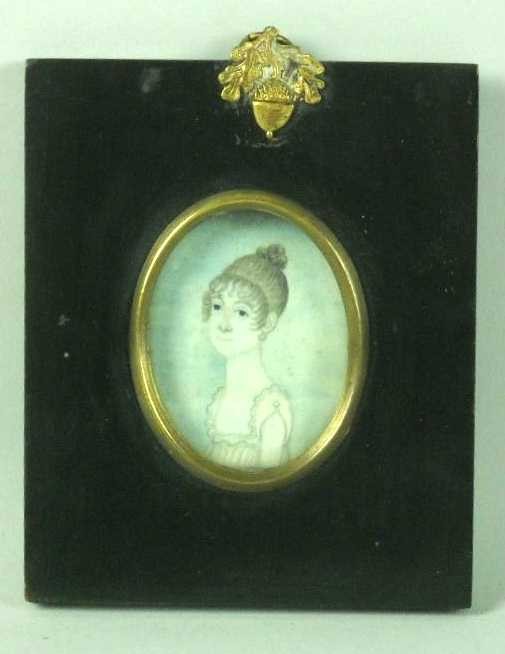 PORTRAIT MINIATURE ON IVORY OF A YOUNG LADY: Empire Period, The Ivory Painting Is Applied To A Foil Backing, Framed In Square Ebonized & Oval Brass Frame With Acorn & Leaf Hanger, 4 3/4"H. 4" W. Ivory Is in Excellent Condition.