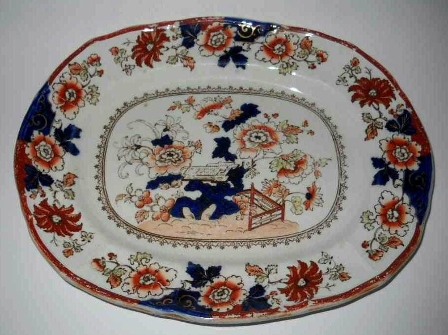 MASON'S "BLUE BIBLE" SMALL CHARGER:: C.1830, Burgandy "Mason's Patent Ironstone China" Crown & Banner Mark, Painted Gilt And Flowers With Foliage Motif, 11"L. 8.5"W. Some Paint Loss To Rim.