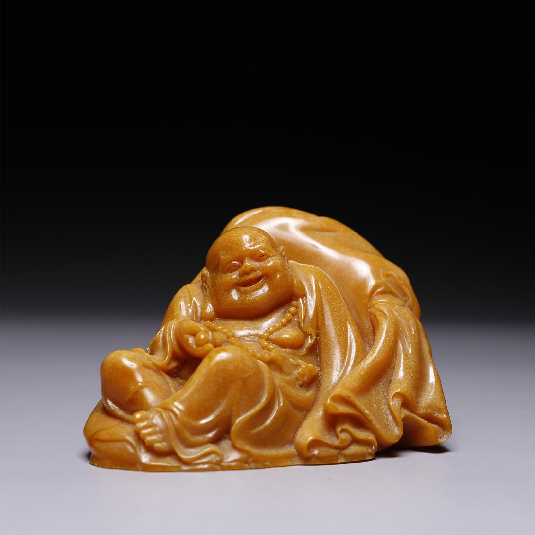 A CHINESE SOAPSTONE TIANHUANG CARVED LOHAN: 2.5 inches high, 3.75 inches wide.