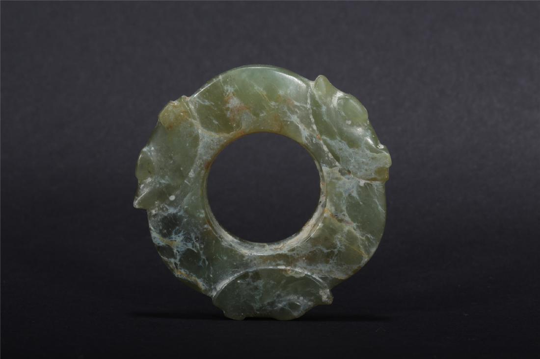 A CHINESE CELADON JADE BI PLAQUE (1 of 9)