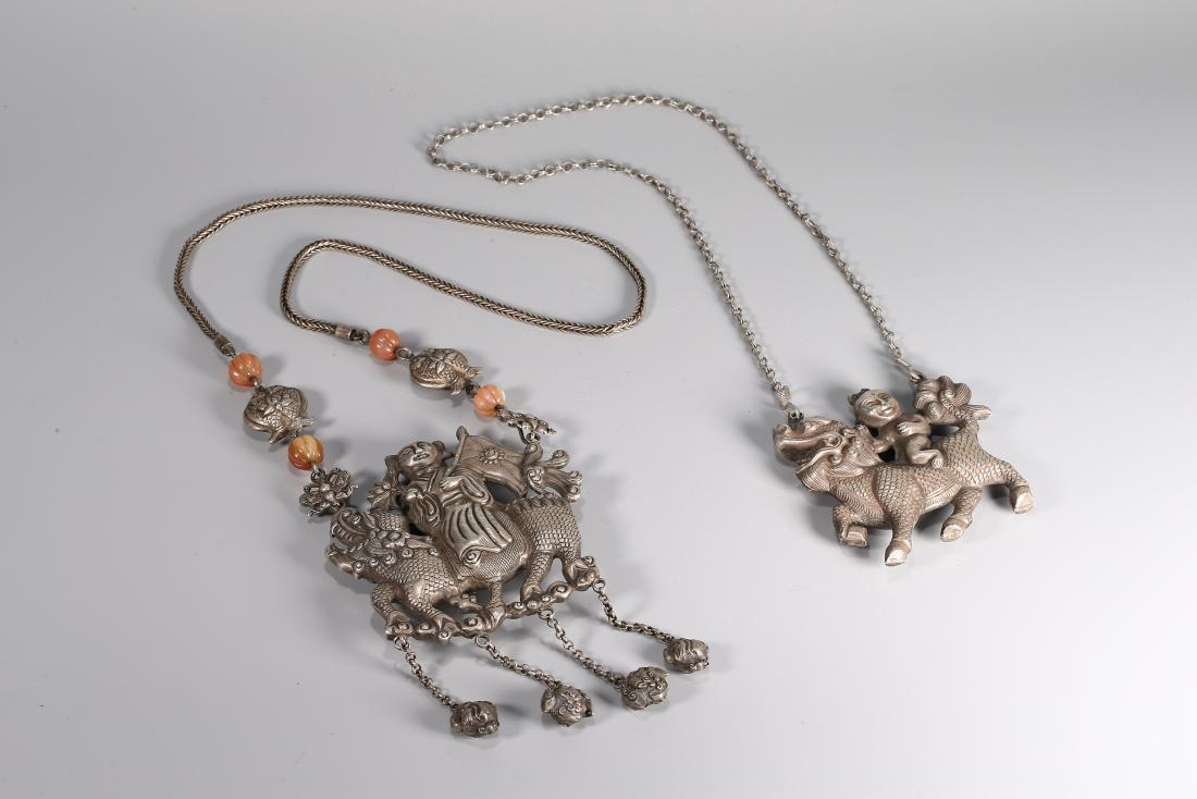 TWO CHINESE SILVER AMULETS AND NECKLACES (1 of 5)