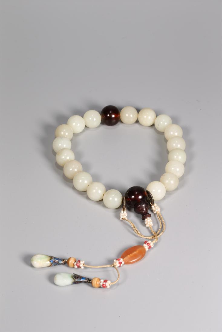 A CHINESE WHITE JADE BEAD BRACELET (1 of 5)