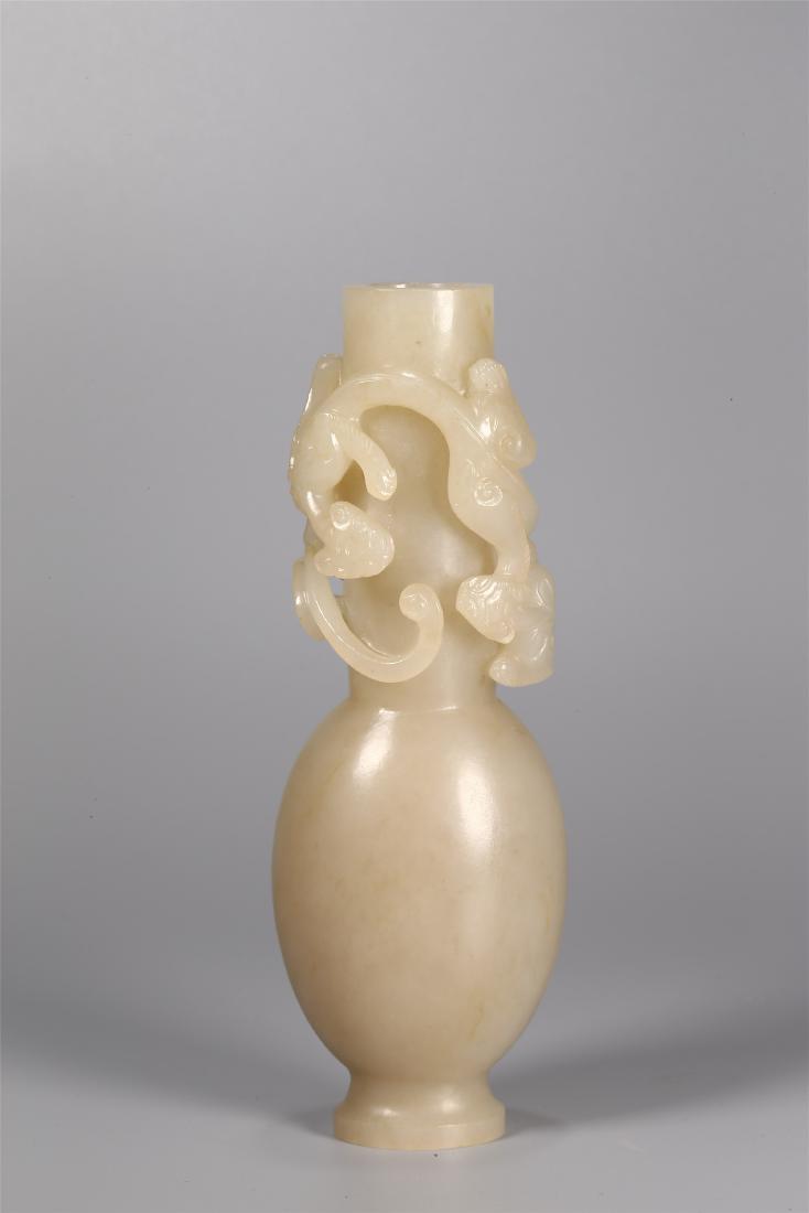 A CHINESE PALE CELADON JADE VASE (1 of 8)