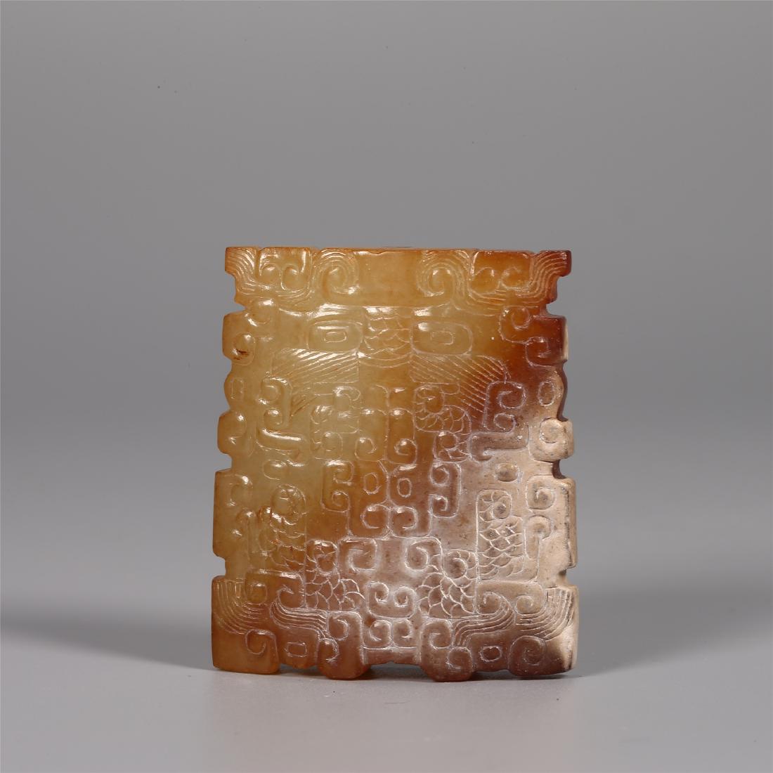 A CHINESE ARCHAISTIC JADE SWORD FITTING (1 of 4)