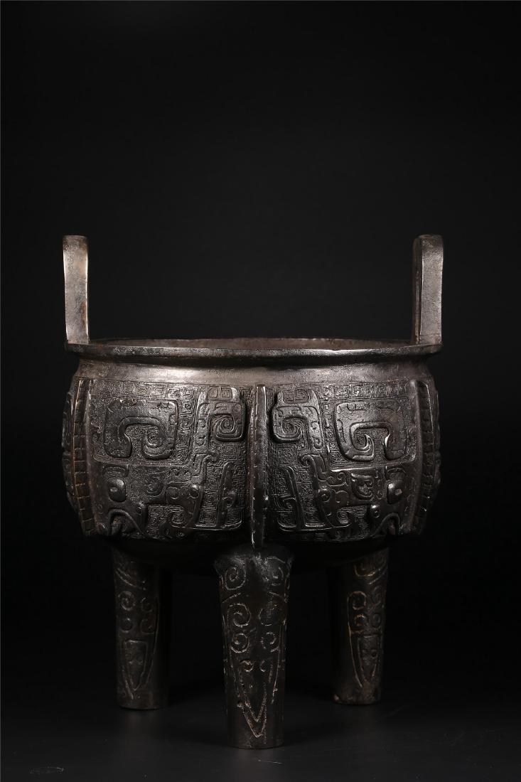 A CHINESE ARCHAIC TRIPOD DING VESSEL (1 of 10)
