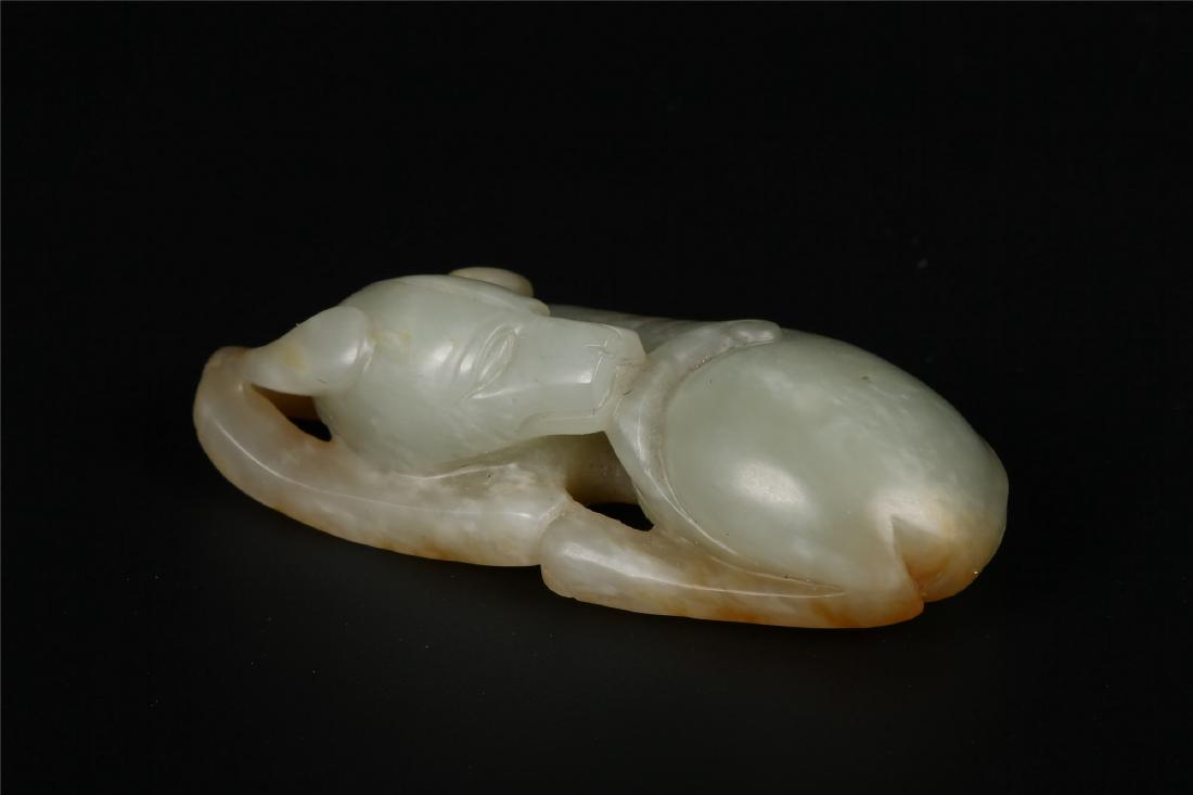A CHINESE PALE CELADON JADE FIGURE OF A DOG (1 of 7)
