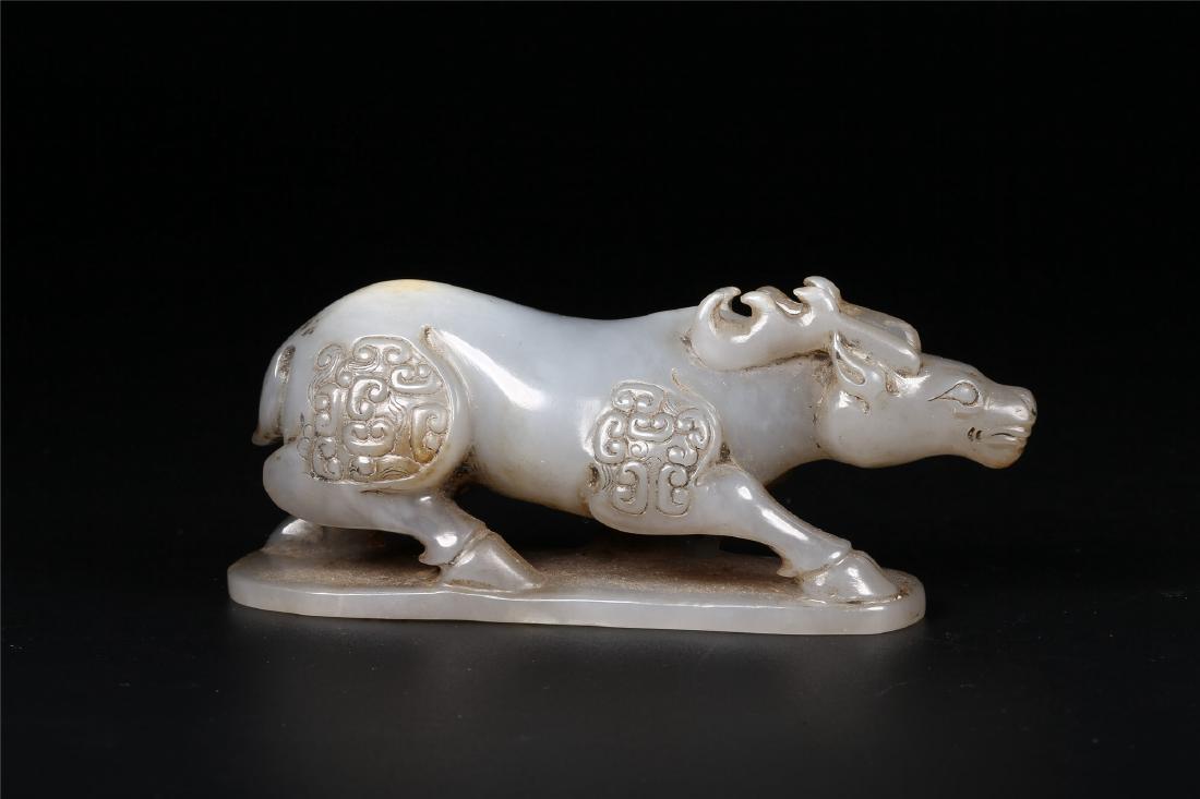 A CHINESE ARCHAISTIC JADE FIGURE OF A BUFFALO (1 of 10)