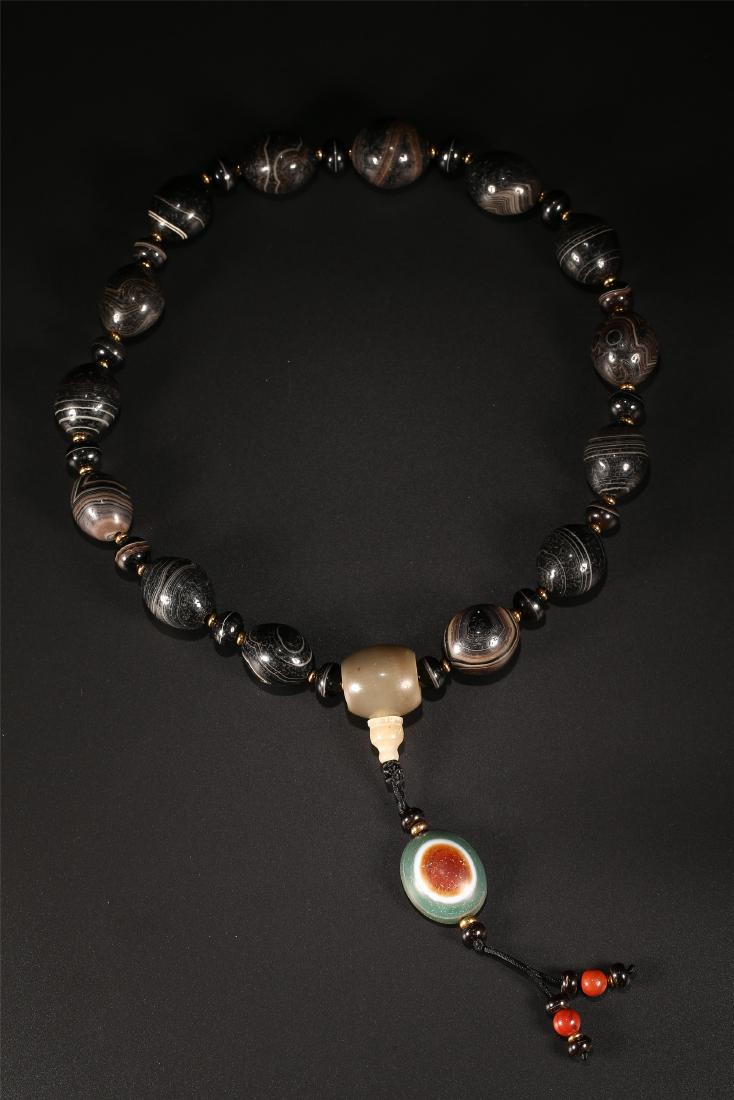A SET OF CHINESE AGATE PRAYER BEADS (1 of 9)