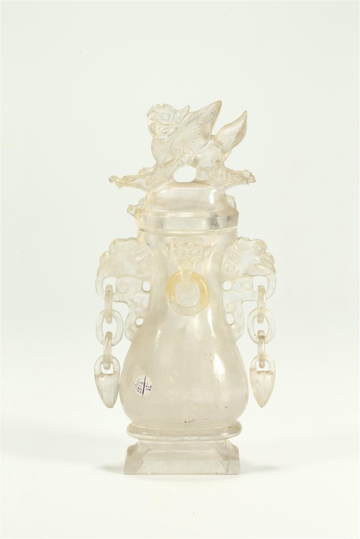 A CHINESE ROCK CRYSTAL MASK AND RING HANDLED VASE AND (1 of 7)