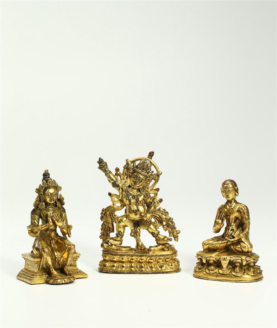THREE CHINESE BRONZE FIGURES OF DEITIES (1 of 10)