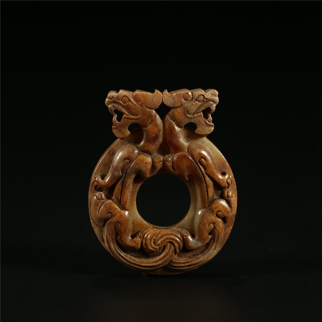 A CHINESE JADE "DOUBLE DRAGON" BI PLAQUE (1 of 5)