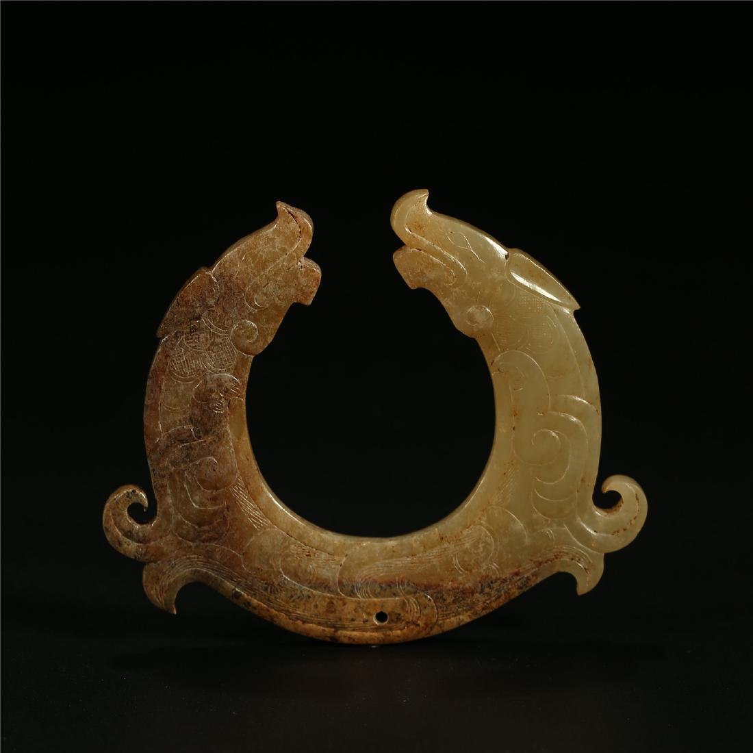 A CHINESE JADE "DOUBLE DRAGON" PENDANT (1 of 4)