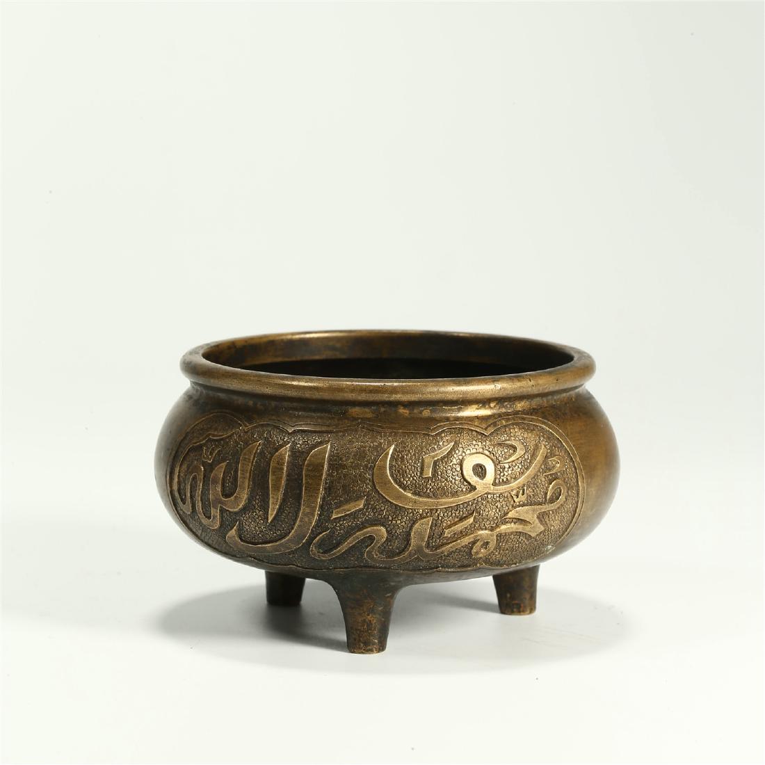 A CHINESE BRONZE ARABIC SCRIPT TRIPOD CENSER (1 of 5)